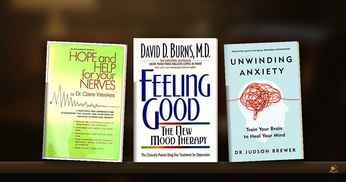 Book covers on a library shelf: Hope and Help for Your Nerves by Claire Weekes, Feeling Good by David D. Burns and Unwinding Anxiety by Judson Brewer