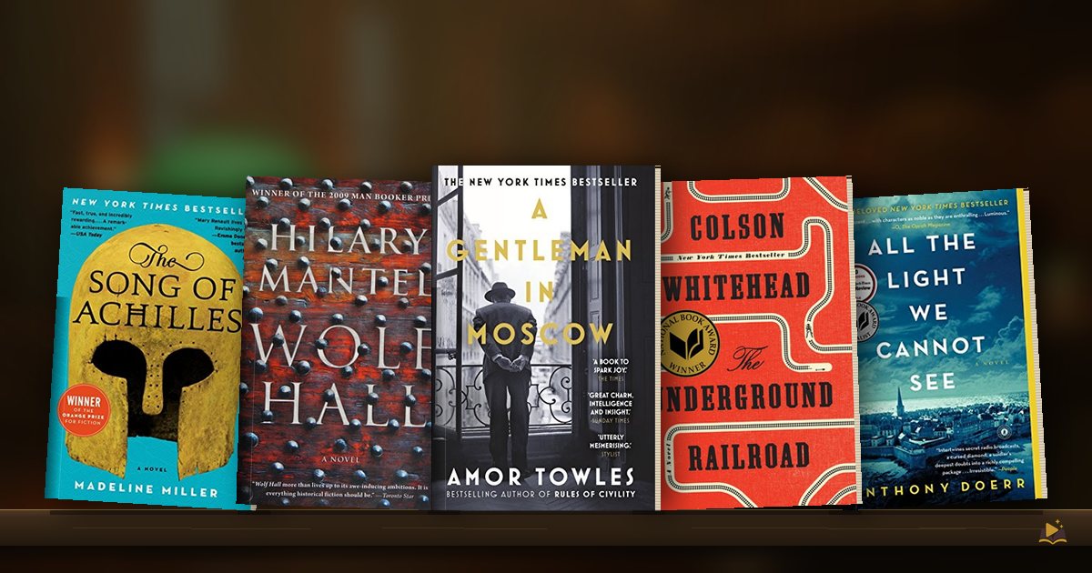 Book covers on a library shelf: The Song of Achilles by Madeline Miller, Wolf Hall by Hilary Mantel, A Gentleman in Moscow by Amor Towles, The Underground Railroad by Colson Whitehead and All the Light We Cannot See by Anthony Doerr