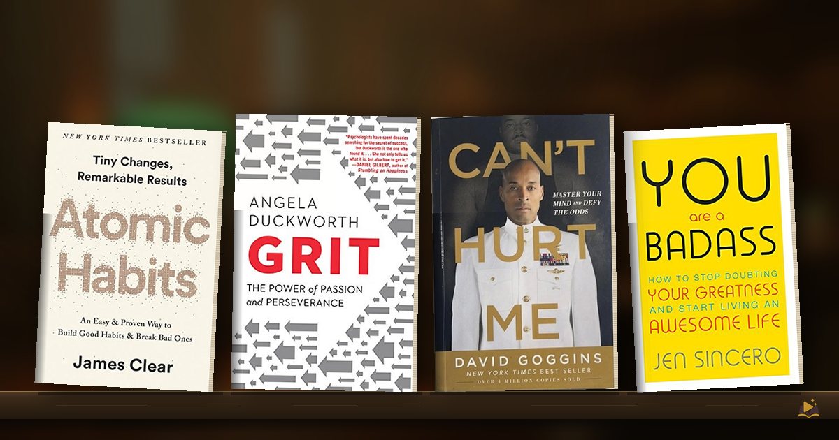 Book covers on a library shelf: Atomic Habits by James Clear, Grit by Angela Duckworth, Can't Hurt Me by David Goggins and You Are a Badass by Jen Sincero