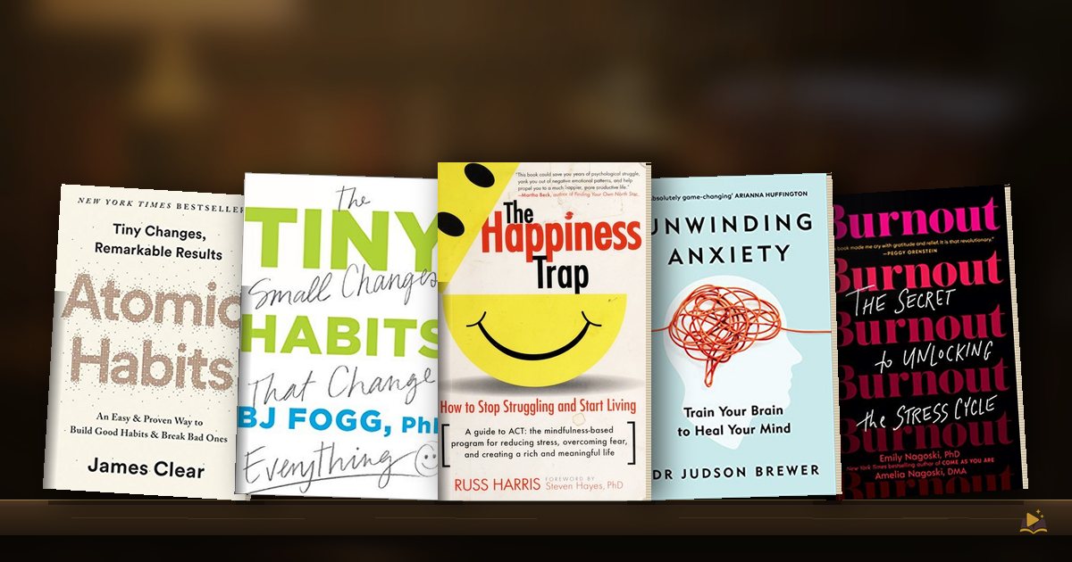 Book covers on a library shelf: Atomic Habits by James Clear, Tiny Habits by BJ Fogg, The Happiness Trap by Russ Harris, Unwinding Anxiety by Judson Brewer and Burnout: The Secret to Unlocking the Stress Cycle by Emily Nagoski Amelia Nagoski